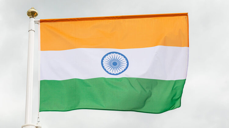 Indian flag in the sky with white clouds - The Deeping