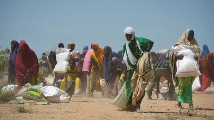 Women-receive-food-aid-in-Somalia - The Deeping
